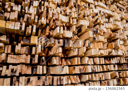 Stack of natural rough wooden boards. Wooden boards, lumber, industrial wood. Stack of natural rough wooden boards. Wooden boards, lumber, industrial wood. 136862565