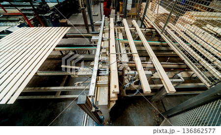 Production line of the wooden floor factory. CNC automatic woodworking machine. 136862577