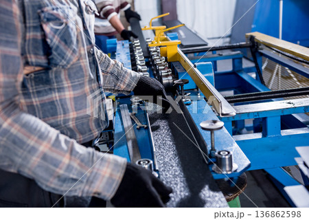 Metal sheet forming machine at the modern metalwork factory. 136862598