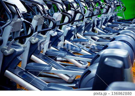 Modern gym interior with new cardio equipment. Modern gym interior with new cardio equipment. 136862880