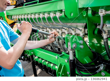 The mechanics repair combine harvester. Modern agricultural machinery The mechanics repair combine harvester. Modern agricultural machinery 136862941