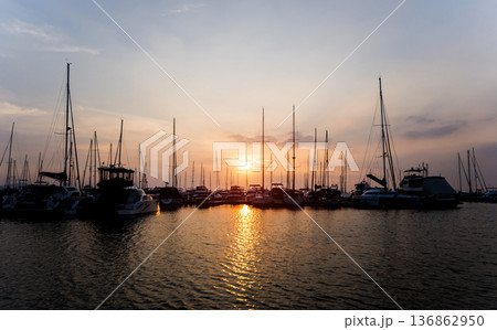 Beautiful view of marina and harbor with yachts and motorboats. Beautiful view of marina and harbor with yachts and motorboats. 136862950