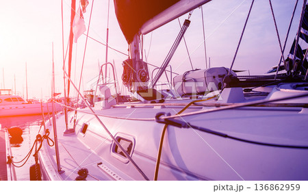 View of harbor with yachts details. Beautiful sunset sky in the marina bay. 136862959