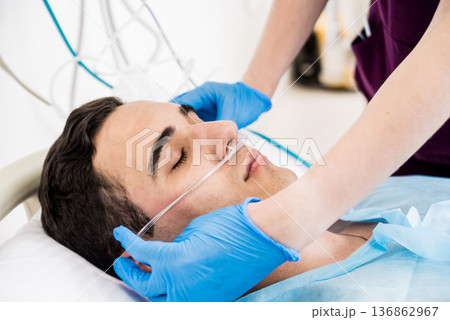 Doctors give resuscitation to a male patient in the emergency room. Doctors give resuscitation to a male patient in the emergency room. 136862967