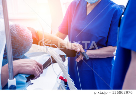 Spinal surgery. Group of surgeons in operating room with surgery equipment. Spinal surgery. Group of surgeons in operating room with surgery equipment. 136862976