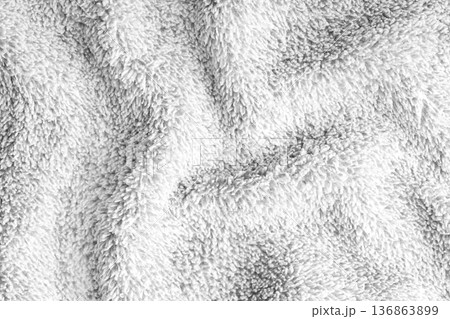 Crumpled fluffy white terry towel microfiber fabric texture with wrinkles and waves background Crumpled fluffy white terry towel microfiber fabric texture with wrinkles and waves background 136863899