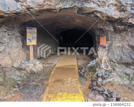 Misiones, Argentina - June 23, 2025: Minera Wanda or the Wanda Mines, in Misiones, Argentina. A close-up of the tunnel entrance. Misiones, Argentina - June 23, 2025: Minera Wanda or the Wanda Mines, in Misiones, Argentina. A close-up of the tunnel entrance. 136864222