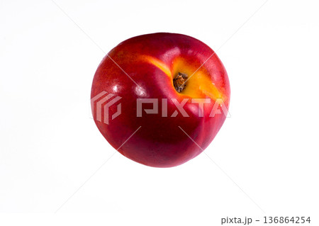 one whole peach on a white background in isolation one whole peach on a white background in isolation 136864254