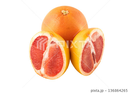 One whole grapefruit and also sliced pieces of grapefruit on a white background in isolation One whole grapefruit and also sliced pieces of grapefruit on a white background in isolation 136864265