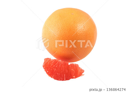 One whole grapefruit and also sliced pieces of grapefruit on a white background in isolation One whole grapefruit and also sliced pieces of grapefruit on a white background in isolation 136864274