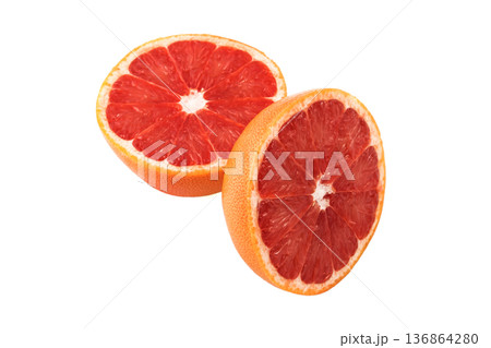 Grapefruit sliced into pieces on a white background in isolation Grapefruit sliced into pieces on a white background in isolation 136864280