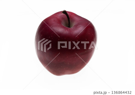 one apple of dark red color on a white background in isolation one apple of dark red color on a white background in isolation 136864432