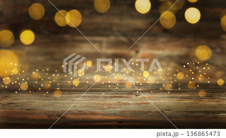 Rustic wooden surface with golden bokeh lights, festive and cozy holiday background Rustic wooden surface with golden bokeh lights, festive and cozy holiday background 136865473