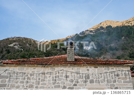 House Roof with Chimney and Smoke 136865715