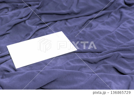 Stylish dusty blue cloth with blank card. 136865729