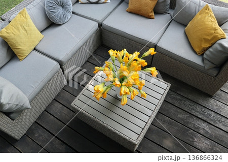 Cozy Outdoor Patio with Sectional Sofa and Yellow Accents 136866324