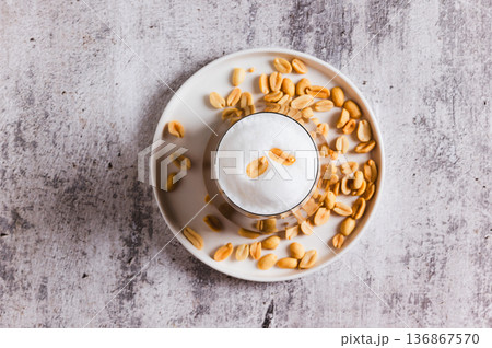 Close up of gourmet peanut raf coffee in a glass on the table top view 136867570