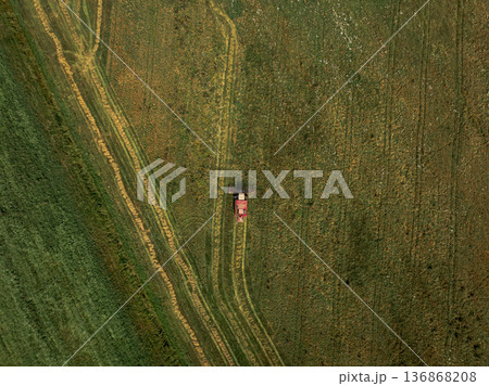 Aerial View of a Tractor in a Green and Yellow Field in Belarus Aerial View of a Tractor in a Green and Yellow Field in Belarus 136868208