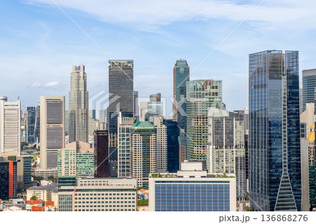 Urban downtown district cityscape featuring high rise commercial buildings and corporate architecture in Singapore CBD Urban downtown district cityscape featuring high rise commercial buildings and corporate architecture in Singapore CBD 136868276