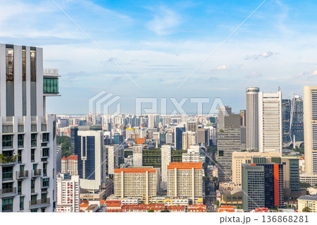 Modern business district skyline with steel and glass skyscrapers rising above the dense metropolitan landscape, Singapore Modern business district skyline with steel and glass skyscrapers rising above the dense metropolitan landscape, Singapore 136868281