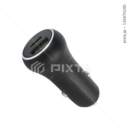 charger for the phone in the car from the cigarette lighter, on a white background charger for the phone in the car from the cigarette lighter, on a white background 136870280