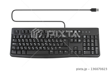 keyboard for a computer, wired with a wire and a connection plug, on a white background isolated keyboard for a computer, wired with a wire and a connection plug, on a white background isolated 136870823
