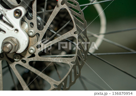 Rotor, brake disk on a bicycle wheel, close up Rotor, brake disk on a bicycle wheel, close up 136870954