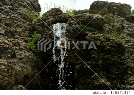 A waterfall, a fall of water originating from rock 136871314