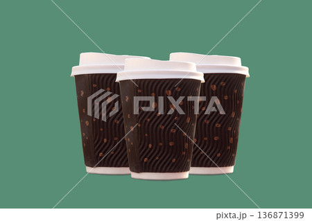 three disposable coffee cup with a lid on a green background in isolation 136871399