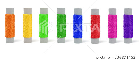 skeins of thread of different colors, set in a row on a white background isolated skeins of thread of different colors, set in a row on a white background isolated 136871452