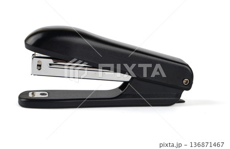 stapler for stapling paper with shadow, on a white background in isolation stapler for stapling paper with shadow, on a white background in isolation 136871467