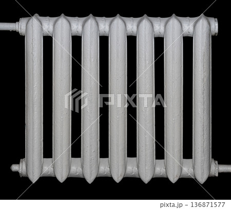 cast iron battery for heating, isolated on a black background cast iron battery for heating, isolated on a black background 136871577