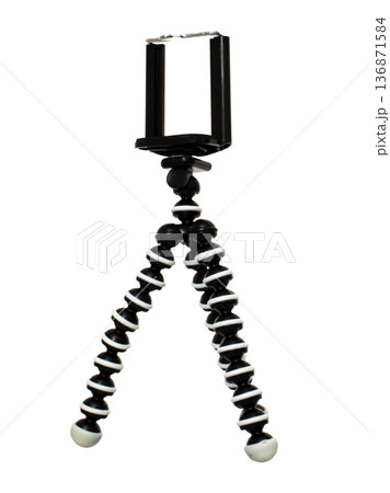 A tripod for a phone, with a mount for a phone, isolated on a white background A tripod for a phone, with a mount for a phone, isolated on a white background 136871584