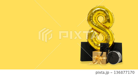 Gold number 8 surrounded by colorful gift boxes and bags Gold number 8 surrounded by colorful gift boxes and bags 136877170