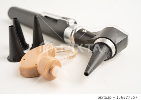 Otoscope isolated on white background for otolaryngologist or ENT physician doctor examining senior patient ear, hearing loss problem. 136877357
