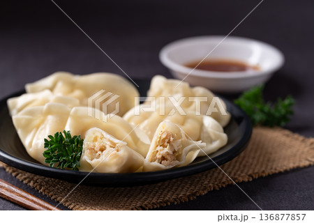 Steamed dumplings filled with pork, chicken and vegetables Steamed dumplings filled with pork, chicken and vegetables 136877857