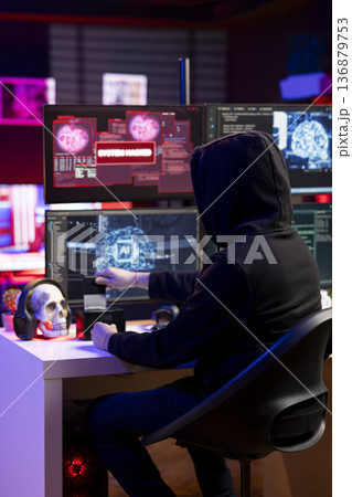 Hacker in neon apartment inserting SSD with stealth malware in PC used to evade security measures. Rogue software developer uploading storage drive with malicious code damaging firewalls Hacker in neon apartment inserting SSD with stealth malware in PC used to evade security measures. Rogue software developer uploading storage drive with malicious code damaging firewalls 136879753