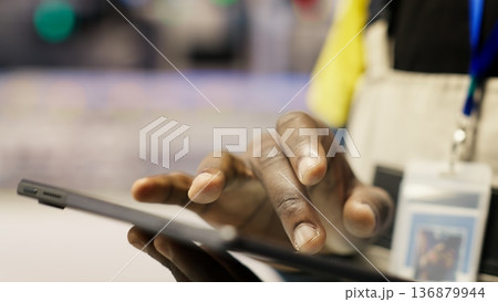 Close up of tablet used by smart factory specialist to implement automated workflows and control systems, computerizing operations. Industry 4.0 plant worker automates production with device, camera B Close up of tablet used by smart factory specialist to implement automated workflows and control systems, computerizing operations. Industry 4.0 plant worker automates production with device, camera B 136879944