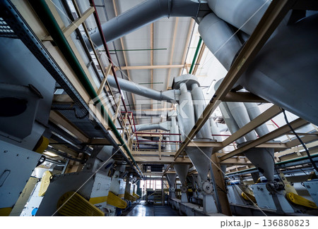 Interior of modern natural oil factory. The piping, pumps and motors Interior of modern natural oil factory. The piping, pumps and motors 136880823