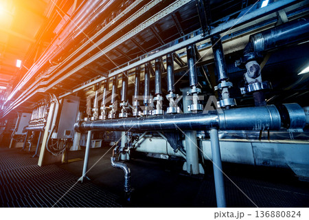 Interior of modern natural oil factory. The piping, pumps and motors Interior of modern natural oil factory. The piping, pumps and motors 136880824