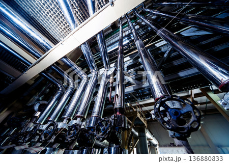 Interior of modern natural oil factory. The piping, pumps and motors Interior of modern natural oil factory. The piping, pumps and motors 136880833