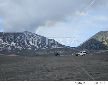 this is Bromo mountain with people and car this is Bromo mountain with people and car 136881453