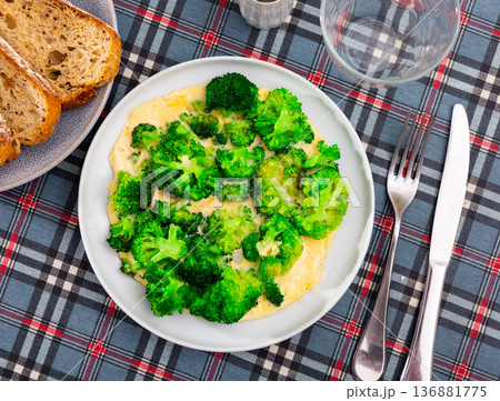 Omelette with broccoli served on plate Omelette with broccoli served on plate 136881775