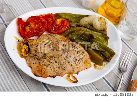 Lunch served on plate - pork chop with stewed vegetable tomato and bell pepper Lunch served on plate - pork chop with stewed vegetable tomato and bell pepper 136881838
