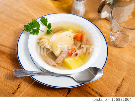 Soup made from fragrant chicken broth, potato slices, pasta and carrots. Soup made from fragrant chicken broth, potato slices, pasta and carrots. 136881864