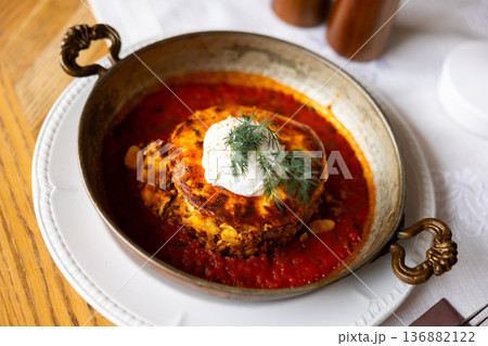 Bulgarian moussaka dish in a round plate 136882122