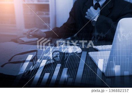 Stock market or forex trading graph and candlestick chart suitable for financial investment concept. Economy trends background for business idea and all art work design. Abstract finance background. Stock market or forex trading graph and candlestick chart suitable for financial investment concept. Economy trends background for business idea and all art work design. Abstract finance background. 136882157