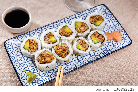Rolls with salmon fish, avocado and fried onions Rolls with salmon fish, avocado and fried onions 136882225