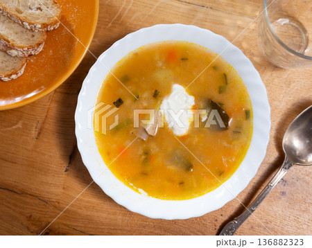 Rassolnik with sour pickles and pearl barley 136882323