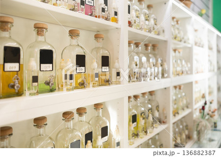 Bottles of perfume for sale on shelves of cosmetic shop Bottles of perfume for sale on shelves of cosmetic shop 136882387